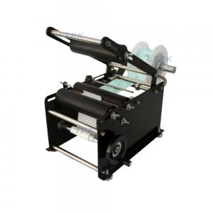 Manual round bottle labeling machine with bottle pressing rod